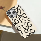 Black Ribbon Bow Print Phone Case for iPhone 16, 15 & 14 Series - Cream Magnetic Dual-Layer PC and TPU Cover